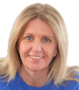 Smiling blonde woman wearing a blue shirt in an office setting photographed from shoulders up, facing the camera.