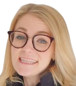 Woman with blonde hair and red glasses making a goofy facial grimace toward the camera.