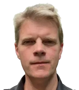 Portrait of a man with short blond hair looking at the camera against a white background